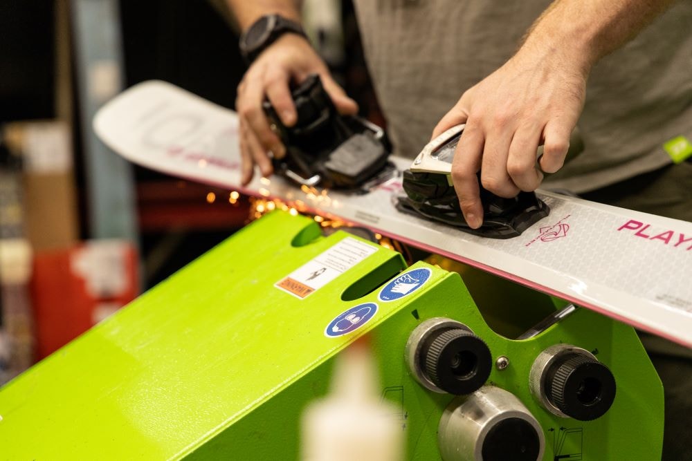Wall of skis and ski boots at a Sun & Ski Sports shop in Phoenix, Arizona.